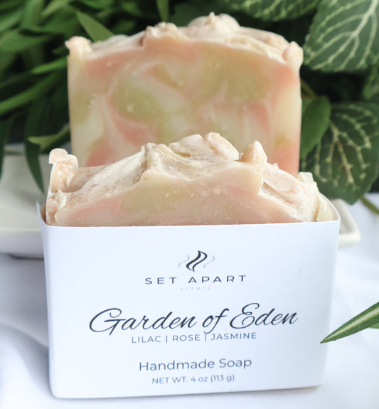 Handmade soap with a 'Garden of Eden' label against a green leafy background